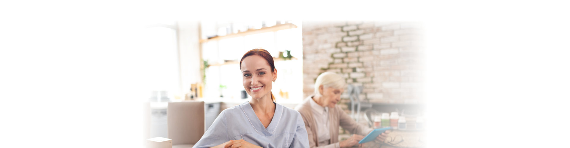 caregiver wearing uniform smiling